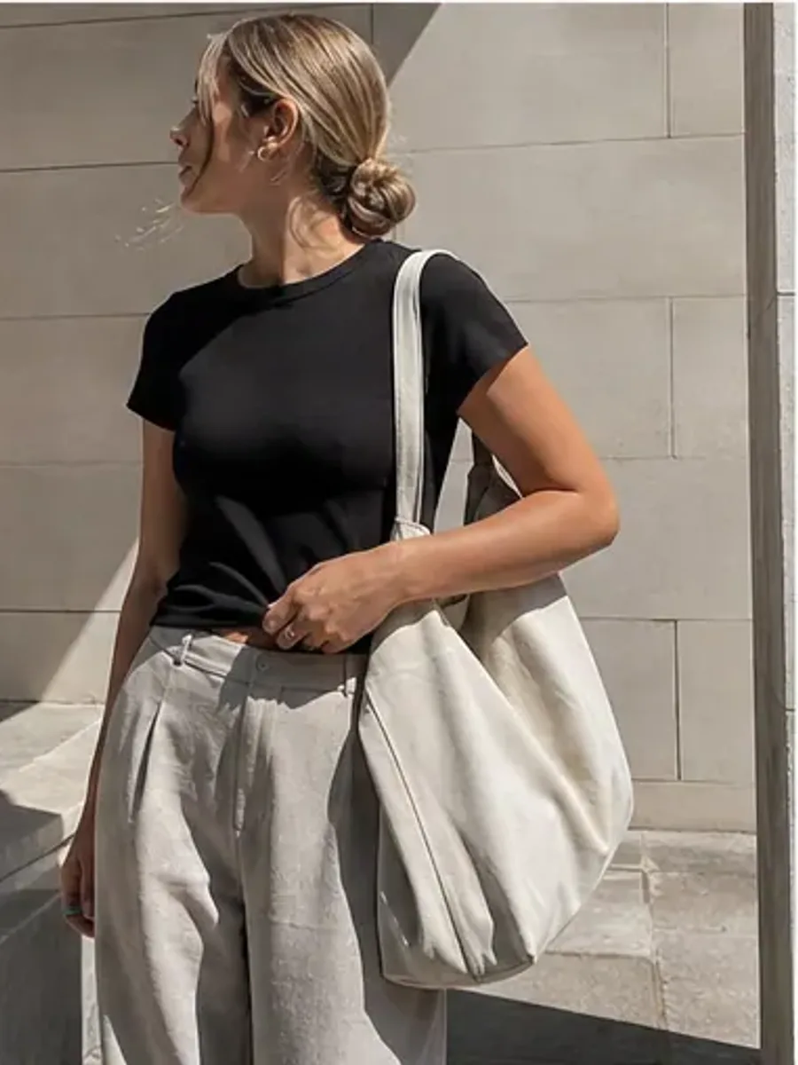 Customer wearing a washed black tee