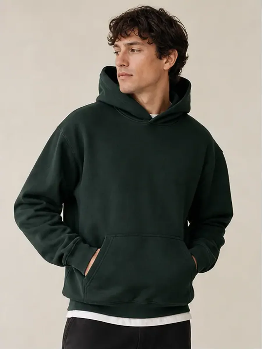 Forest green heavyweight cotton hoodie on model